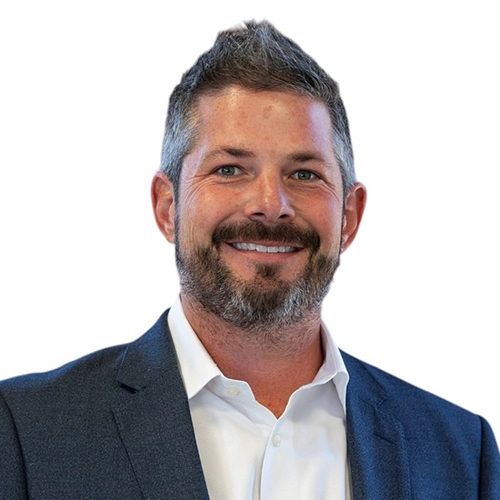 Portrait of Cody Garner, Antique Brick & Block team member, smiling in a navy blazer