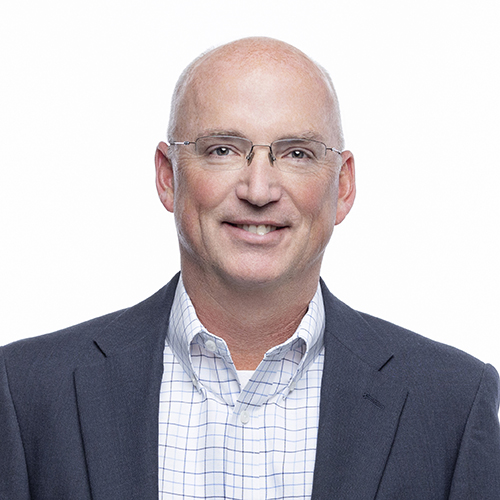 Portrait of Tim Gartman, PE, Antique Brick & Block team member, in glasses and gray blazer