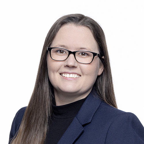 Portrait of Valerie Sandoie, Antique Brick & Block team member, in glasses and navy blazer