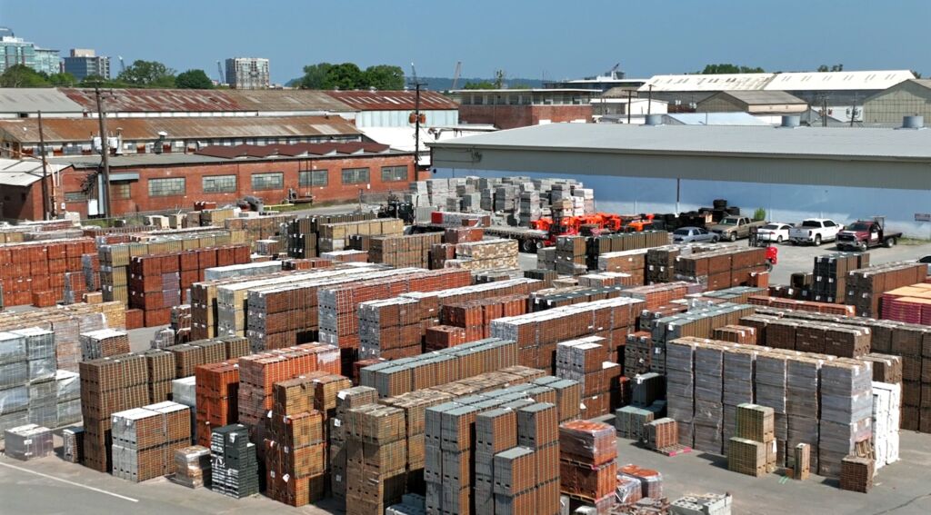 Aerial view of the Antique Brick & Block yard, stacked with pallets of brick and block